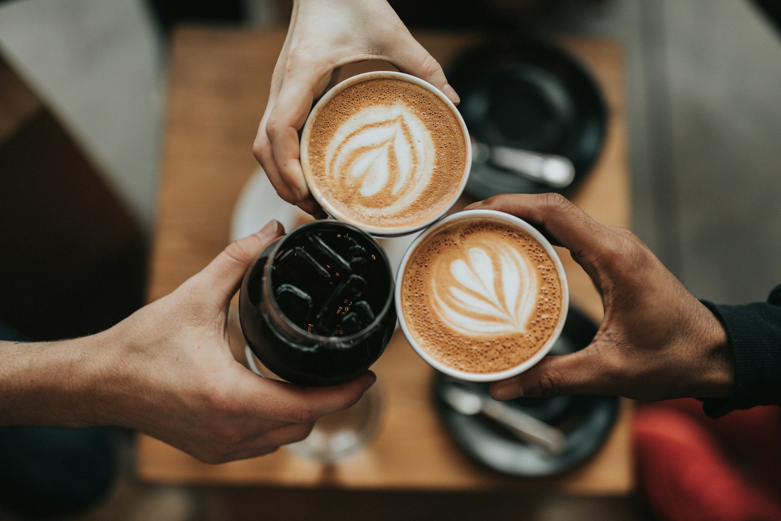 Overhead shot of a fresh cup of Cielo on a wooden table
